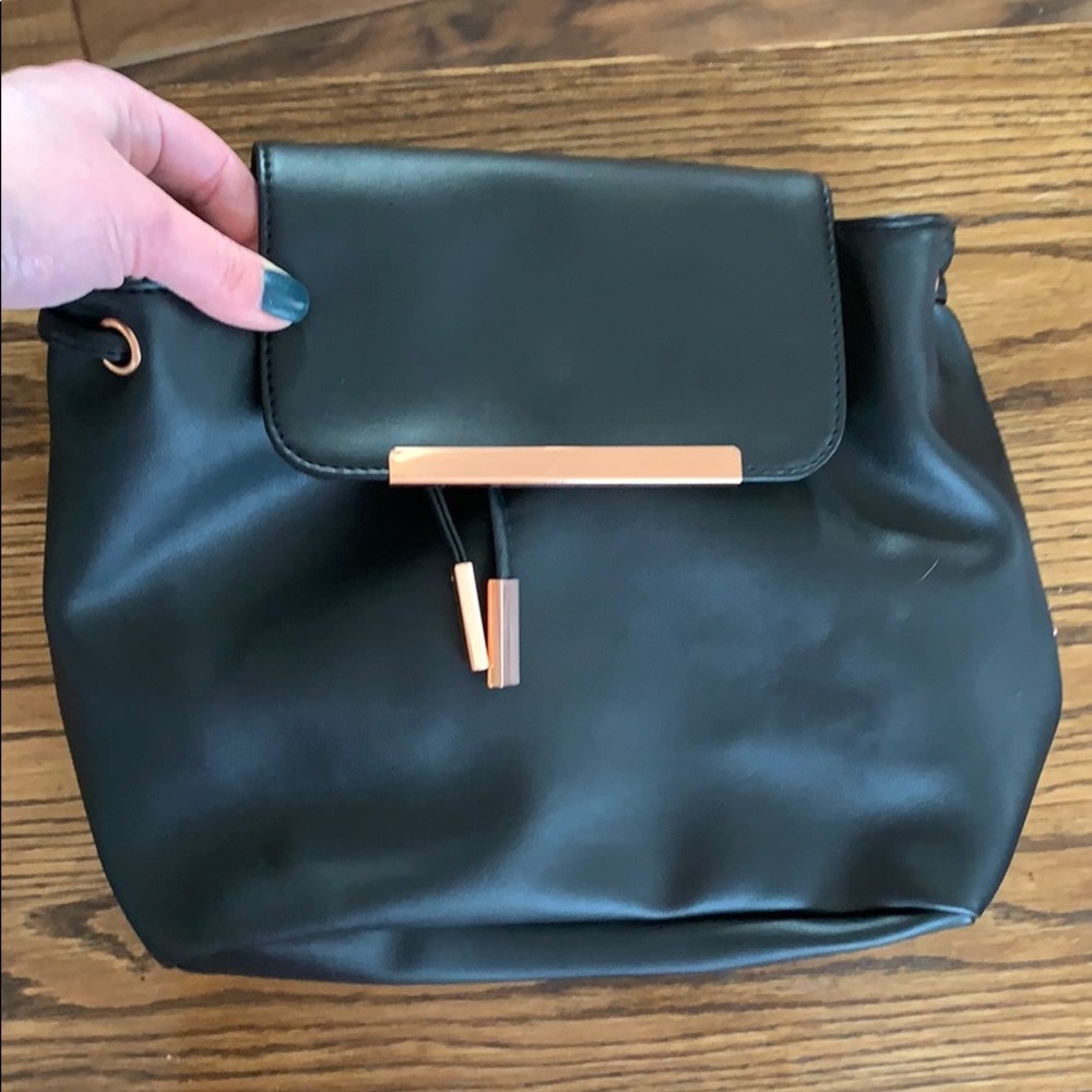 Black pleather backpack with rose gold accents